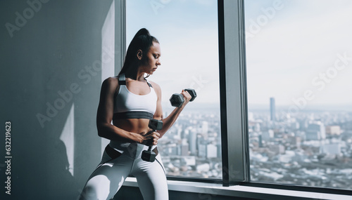 modern young african american woman in a gym in a large city
