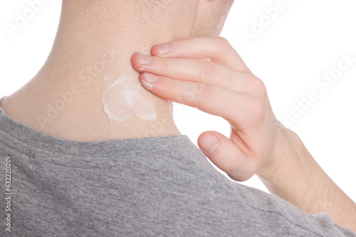 Man applying ointment onto his neck on white background, closeup