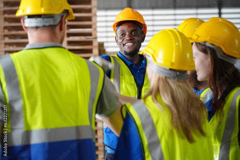 Team of warehouse employees working on inventory in a large distribution warehouse. Business factory industry concept. Team of warehouse employees working on inventory in a large distribution warehouse. Business factory industry concept.