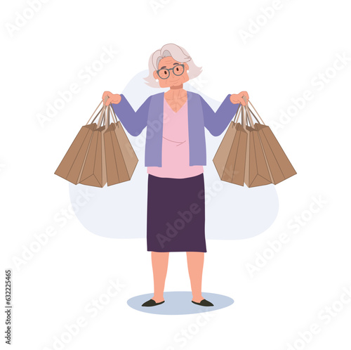 Happy Granny Holding Shopping Bags. Elderly Woman Enjoying Shopping with Shopping Bags. Senior Lifestyle and Retail Therapy