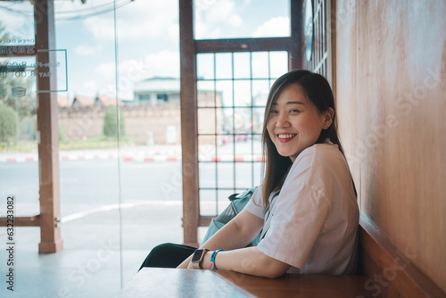 asian woman smile and happy during relax in coffee shop Free Download asian woman smile and happy during relax in coffee shop - GFXLoad