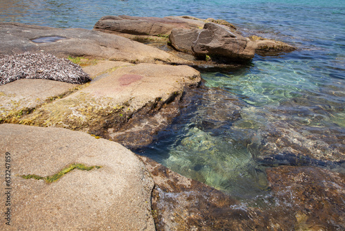 Rocks at the beach in Algajola Village in Corsica © jeancliclac