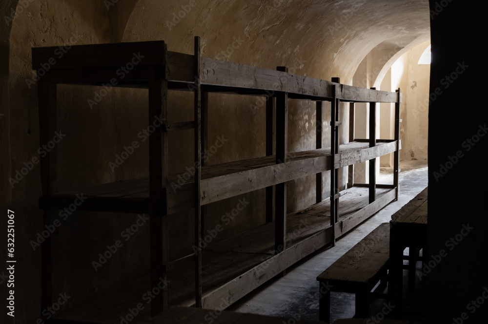 Wooden bunk beds in mass prison cells in the Small Fortress, which