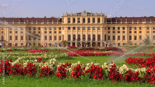 Famous Schonbrunn Palace with scenic Great Parterre garden on a beautiful sunny day with blue sky and clouds in summer. photo