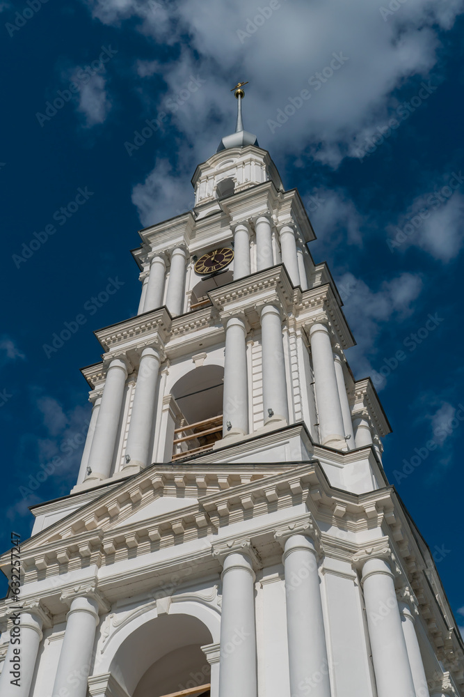Kalyazin, Russia, July 3, 2023. View of the bell tower with a spire and a cross.