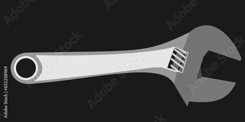 An adjustable wrench isolated on a black background, it  s a type of wrench which can be adjusted according to different settings, to fit for size to a wide range of hexagonal nuts