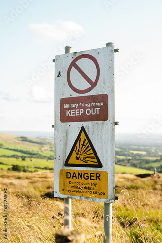 Military keep out signs in field 