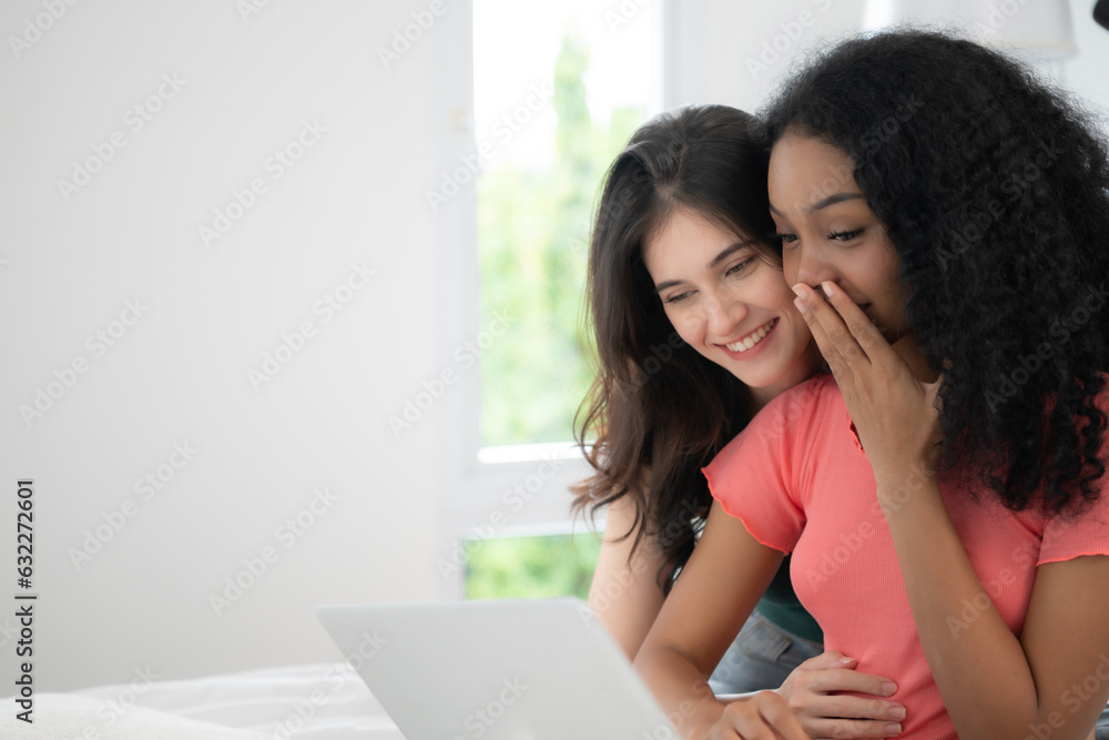 Happy Lesbian Couple Using Laptop On Bed At Home Young Multiethnic Lesbian Couple Using Laptop 