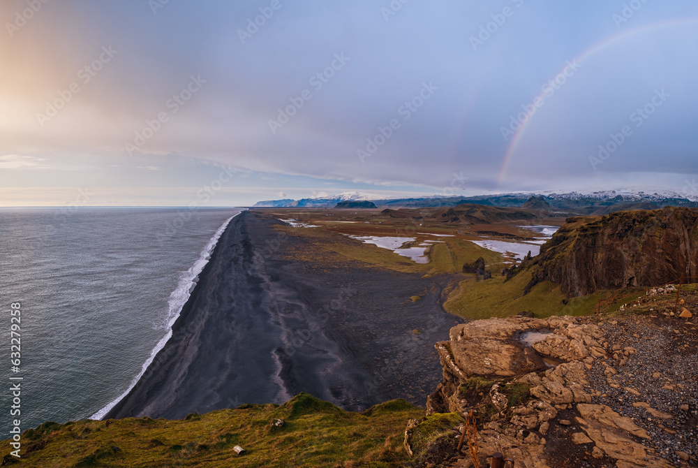 Picturesque autumn evening view to endless ocean  black volcanic sand beach from Dyrholaey Cape Viewpoint, Vik, South Iceland.