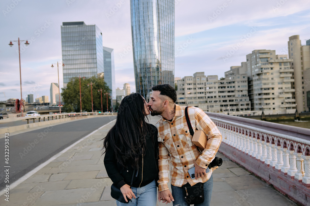 Young couple kissing in the middle of the city