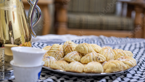 Arabic coffee and maamoul on arabic white shamgh photo