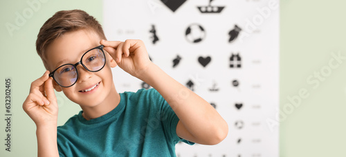 Little boy wearing glasses ...