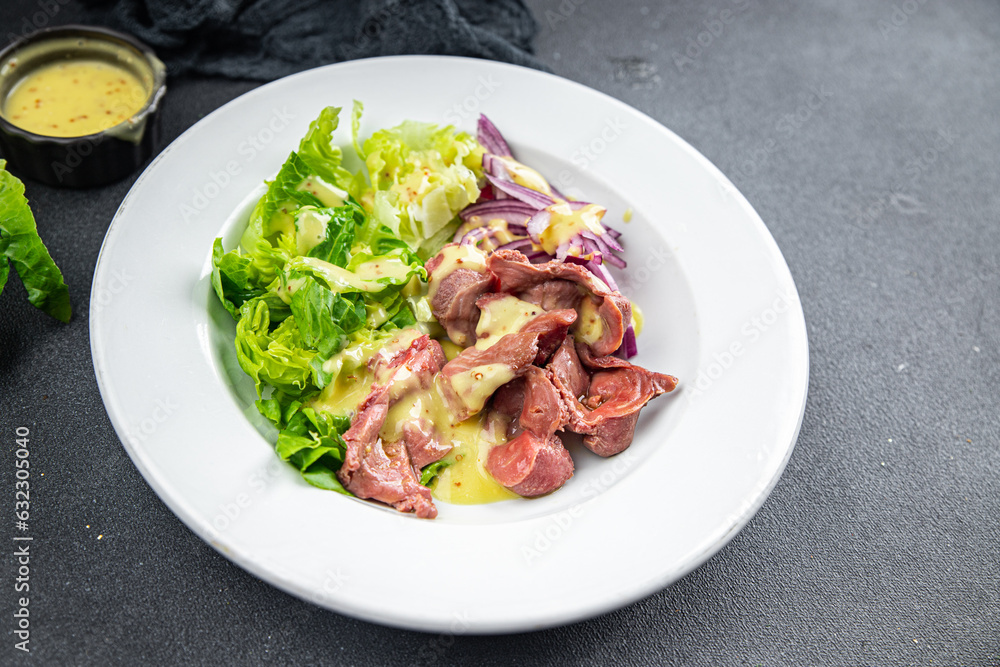 chicken stomach salad green lettuce, onion, salad dressing vegetable meal food snack on the table copy space food background rustic top view chicken stomach salad green lettuce, onion, salad dressing vegetable meal food snack on the table copy space food background rustic top view