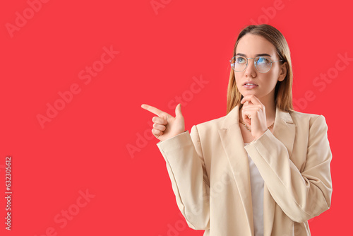Thoughtful young businesswo...
