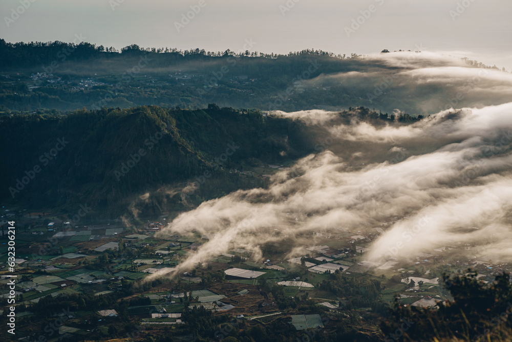 Amazing panorama view of village at the mount Batur. Rural Pinggan pano view with volcano Batur