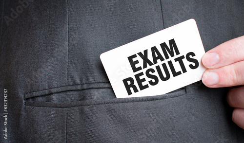 Card with EXAM RESULTS text in pocket of businessman suit. Investment and decisions business concept.