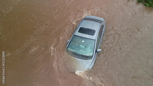 Drone Shot Parking Lot With Flooded Cars After Heavy Rainstorm in Bedford Canada. Impact of Climate Change. After a Heavy Rain, Flood-Like Swamp in a Supermarket Parking Lot. Flooded car in rain water photo