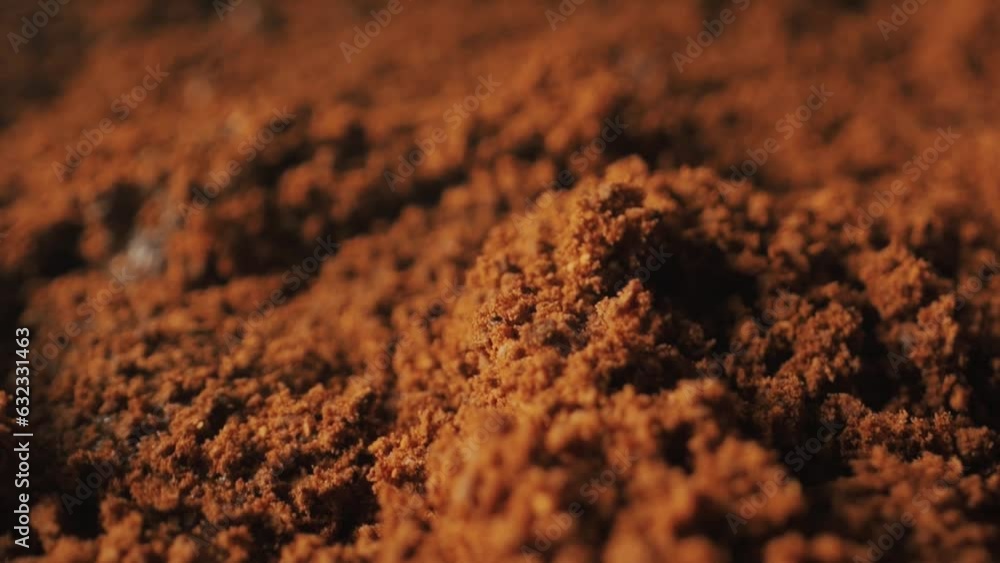 Ground coffee close-up. Roasted coffee. Coffee powder close-up. Fresh powder of ground coffee falling. Ground coffee close-up. Roasted coffee. Coffee powder close-up. Fresh powder of ground coffee falling.