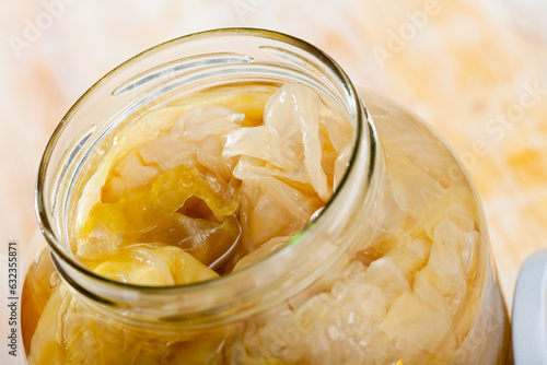 Fotografía Pickled cabbage leaves in brine in glass jar