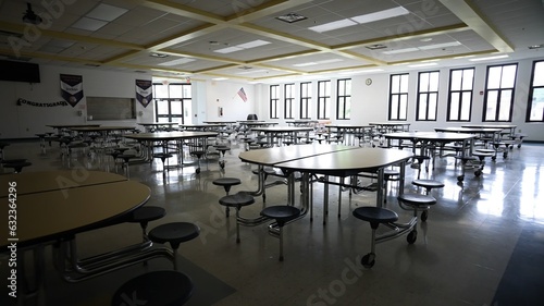 Plakat Empty school cafeteria with tables and seats.