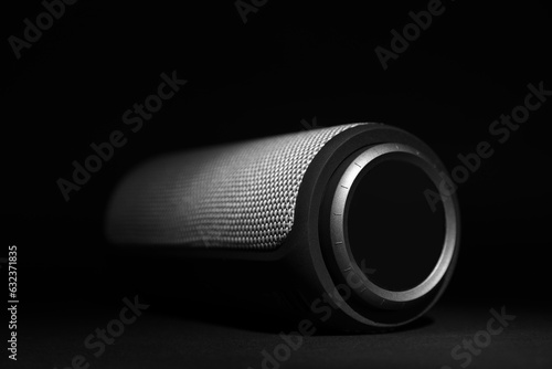 One portable bluetooth speaker on black background, closeup. Audio equipment