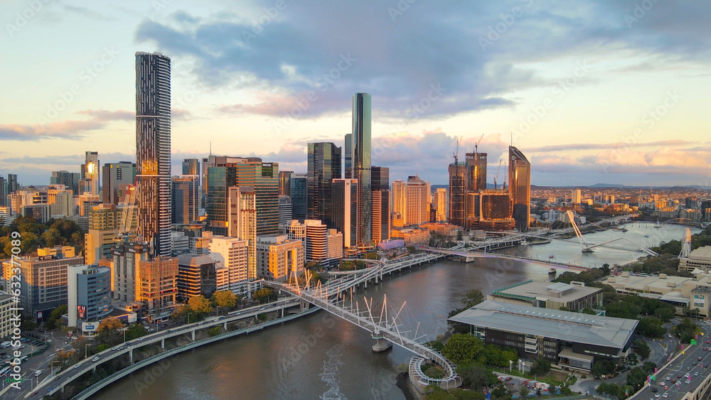 Aerial drone view of Brisbane City, QLD, Australia looking toward the west facing side of the city along Brisbane River and Riverside Expressway during late afternoon in August 2023    