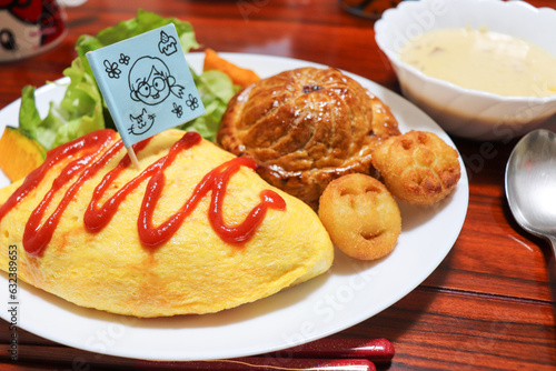 似顔絵が描かれた旗を指したオムライスプレートランチ