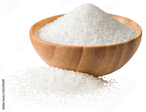 Shredded coconut in the wooden bowl, isolated on the white background. photo