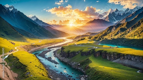 Mountain landscape with river and snow-capped peaks at sunrise © Viewvie