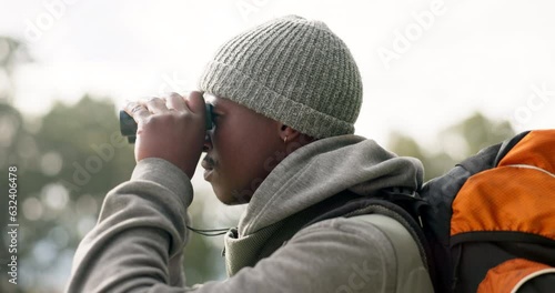 Wallpaper Mural Black man, binoculars and backpack in travel for sightseeing or looking for path and hiking trail in nature. African male person or hiker with vision to explore adventure, sight or journey outdoors Torontodigital.ca
