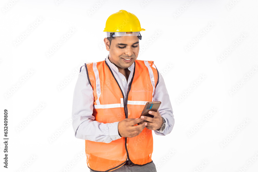 Engineer using smartphone on white background. Engineer using smartphone on white background.