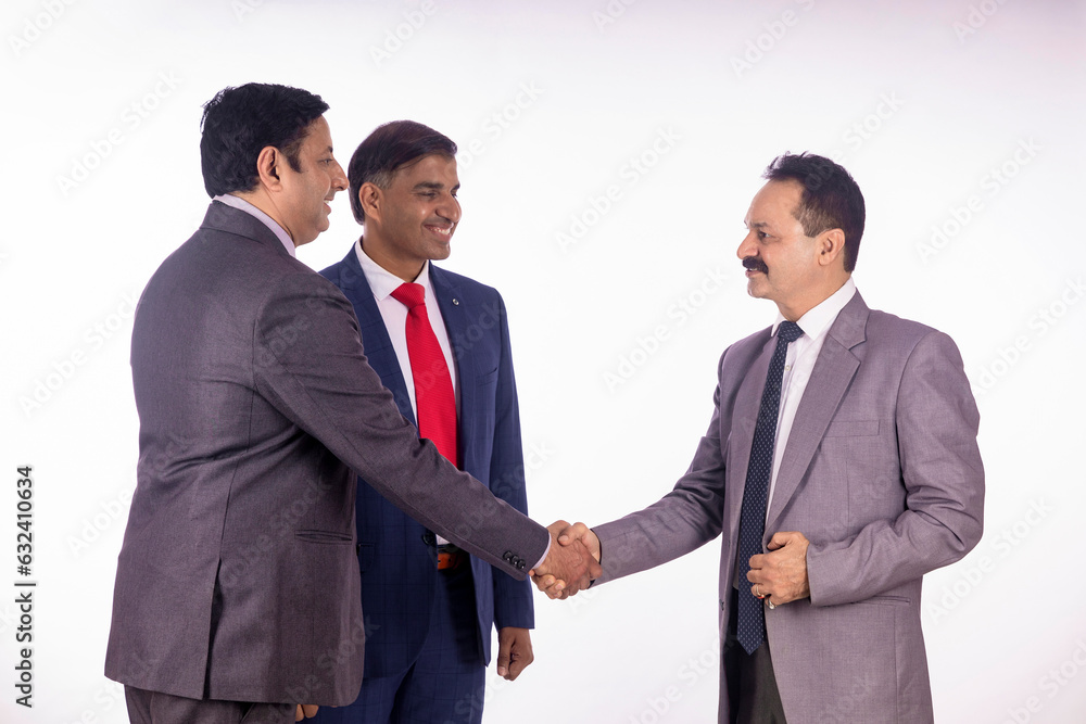 Indian businesspeople group hand shake after successful meeting Indian businesspeople group hand shake after successful meeting