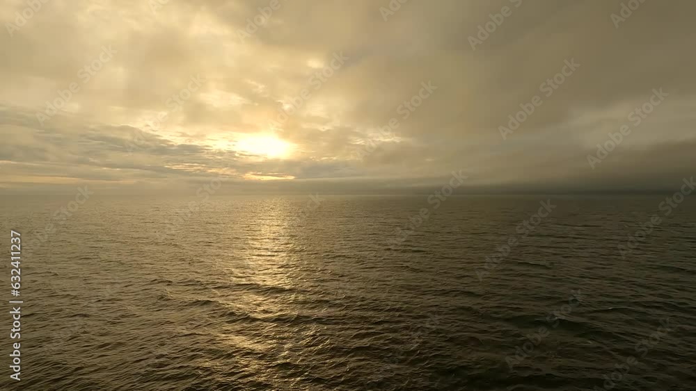 Sunrise at sea on an overcast, misty morning - hyper lapse Sunrise at sea on an overcast, misty morning - hyper lapse