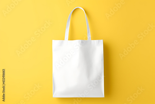White tote bag mockup on yellow background photo