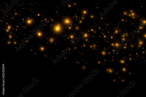 Golden fireflies floating in the dark