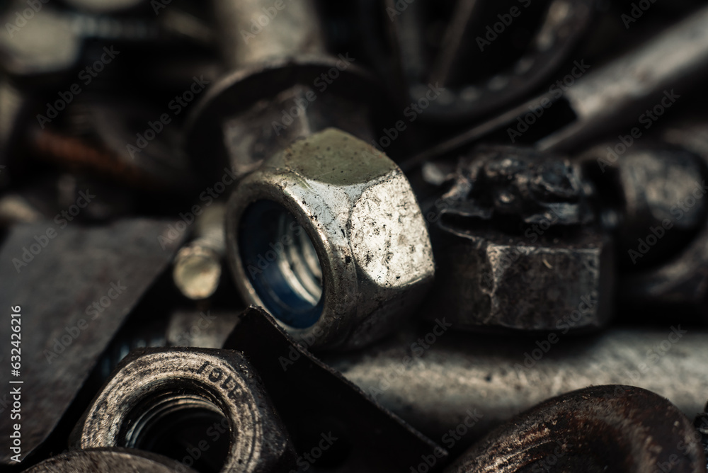 Background with bolts, screws and other repair parts in close-up. Metal parts for various repairs. Macro of recycled metal bolts Background with bolts, screws and other repair parts in close-up. Metal parts for various repairs. Macro of recycled metal bolts