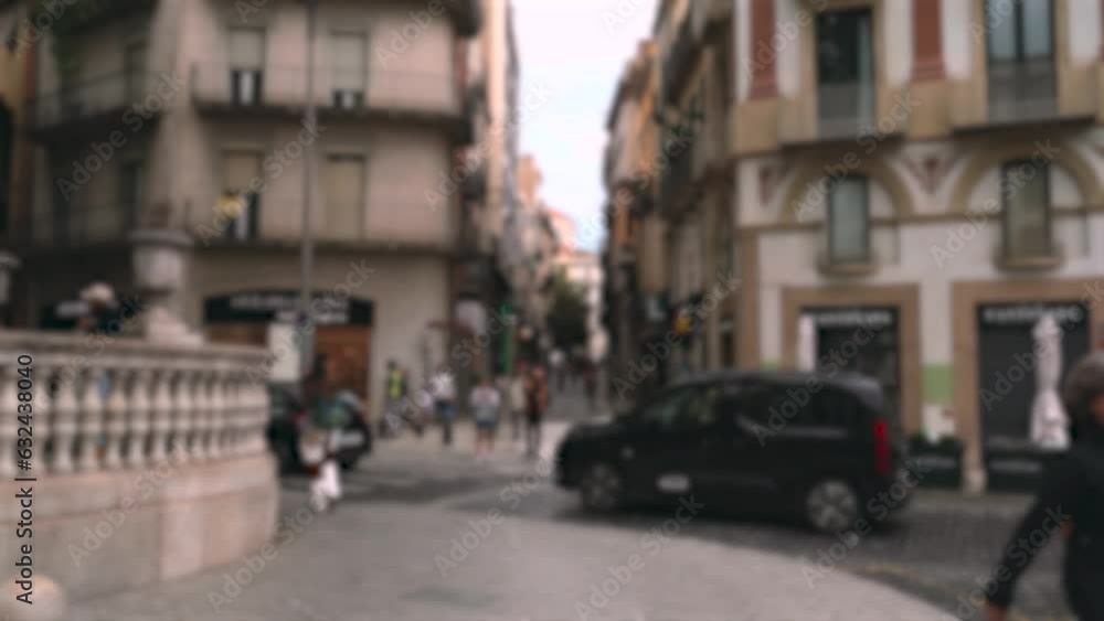Background, blurry video. View of the pedestrian street in the city center, along which people walk, and the roadway with cars. Background, blurry video. View of the pedestrian street in the city center, along which people walk, and the roadway with cars.