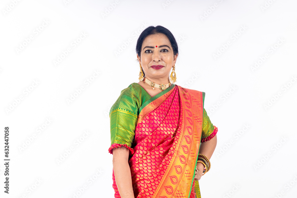 indian woman in traditional saree standing on white background