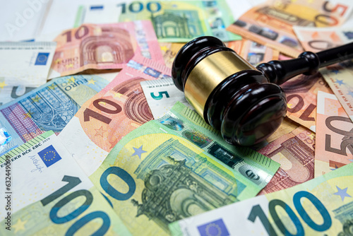 rule of law and auctions with judge's gavel and euro banknotes
