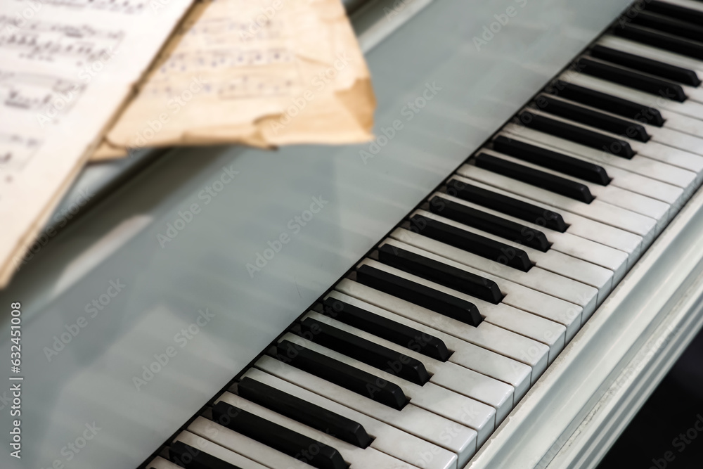 Key Notes. Photo Piano keys, notes on the cover of the instrument, music background ...