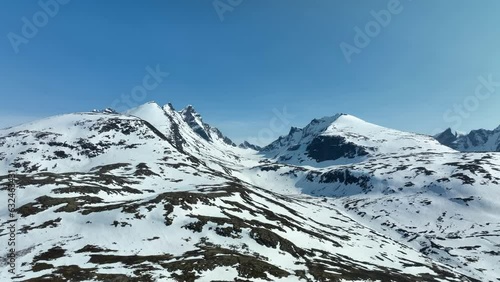 Hurrungane pointy mountains in Sognefjellet and Jotunheimen Norway - Summer aerial with melting snow left in landscape photo