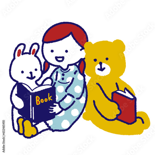 動物と絵本を読むかわいい女の子