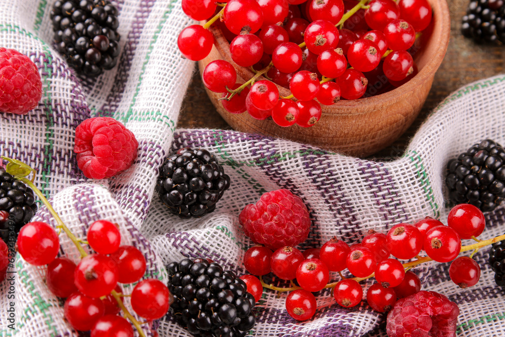 Various berries, raspberries, blueberries, currants, blackberries on a napkin. Various berries, raspberries, blueberries, currants, blackberries on a napkin.