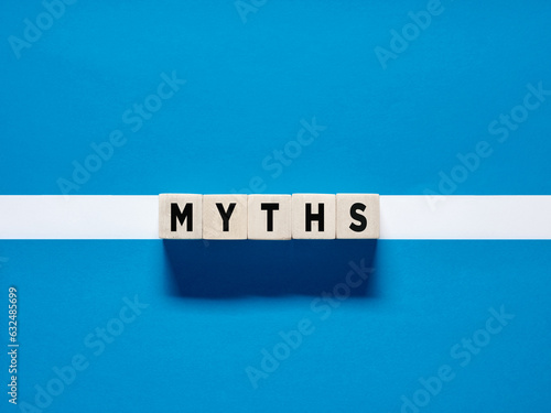 фотографія The word Myths on wooden cubes on blue white background.