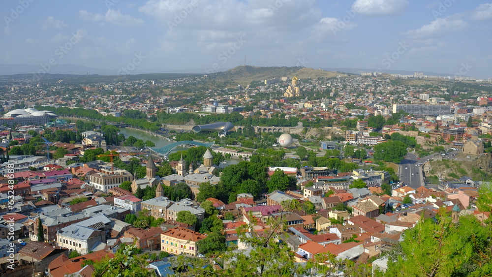 landscape old Town and houses of Tbilisi , Georgia from Above Narikala fort: Holy Trinity Cathedral, Tranquil Lake Views, Peace Bridge Charm, Nmetekhi St. Virgin Church Heritage Zion Cathedral Majesty