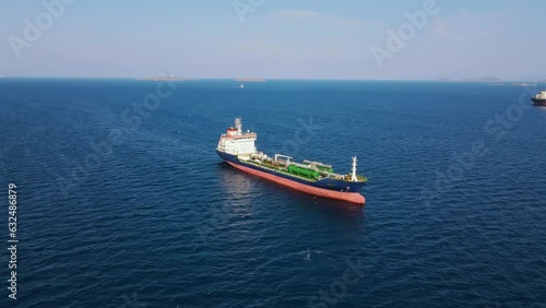 Cargo Oil chemical tanker ship in anchorage near industrial port at sea, aerial shot photo
