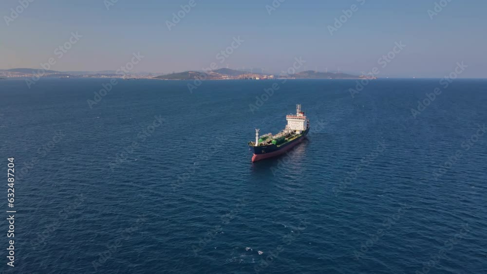 Oil chemical tankers anchored near port of oil chemical plant, aerial drone shot Oil chemical tankers anchored near port of oil chemical plant, aerial drone shot