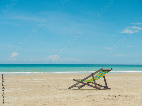 Sun bed chair on empty tropical ocean beach at hat Namsai East of Thailand.