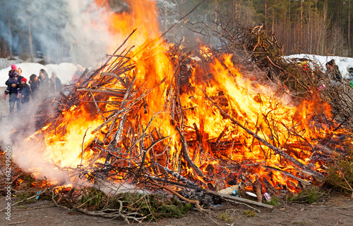 Umea, Norrland Sweden - April 30, 2023: May bonfire with crowd in the background