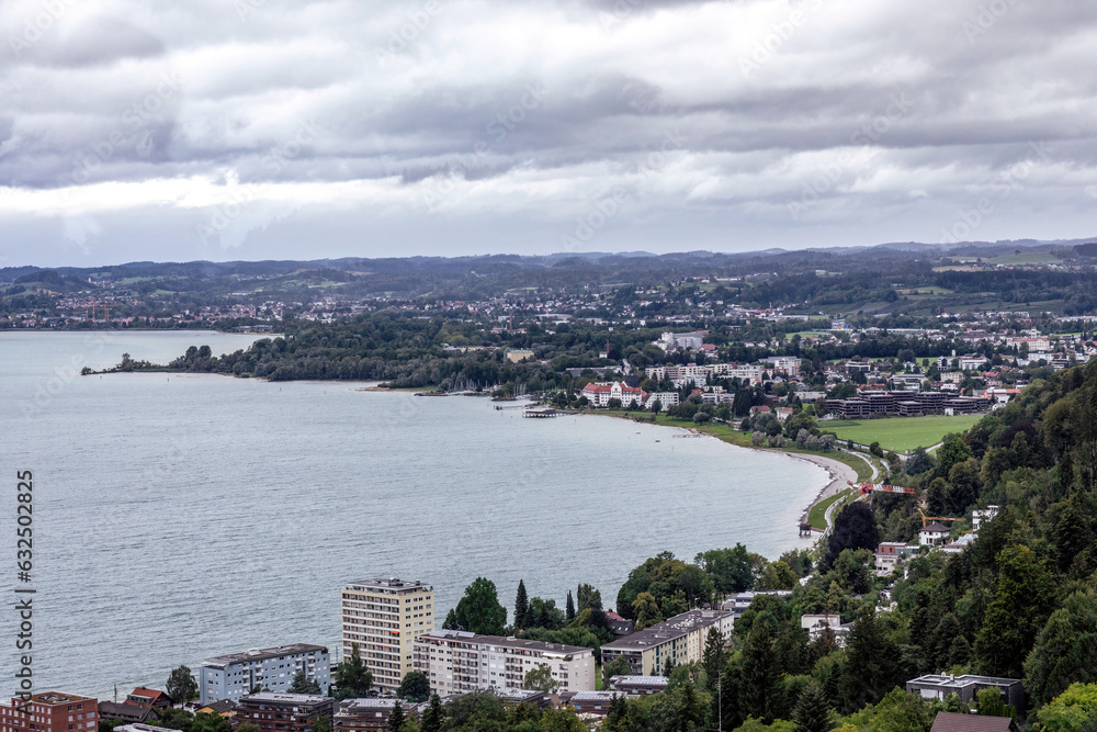 View at Bregenz and surrounding towns and mountains from mount Pfänder, a local mountain in austria at a rainy day in summer
